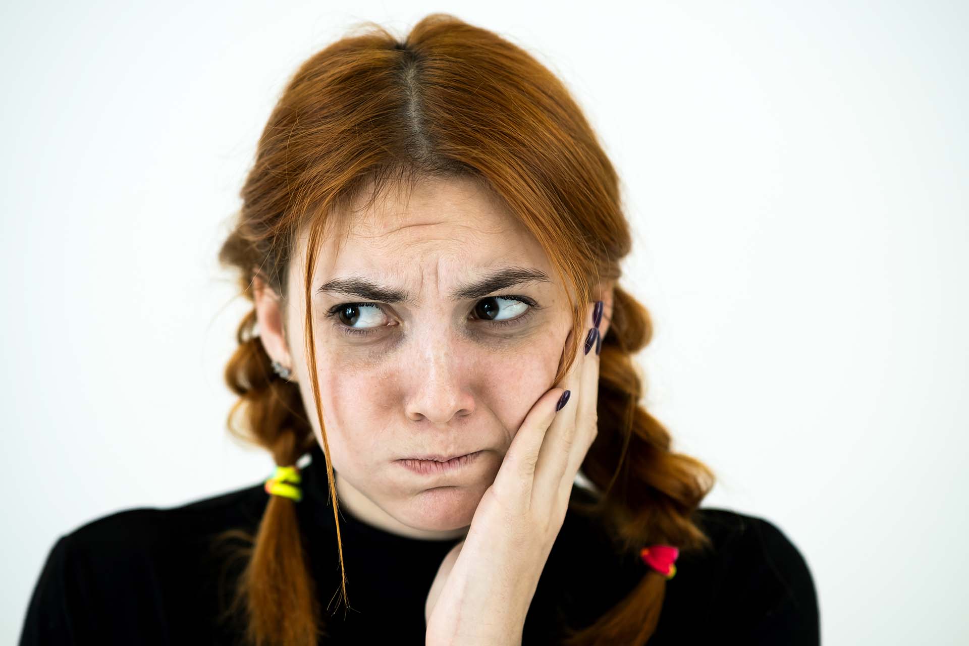 A concerned parent observing a defiant child, symbolizing the challenges of managing Conduct Disorder.