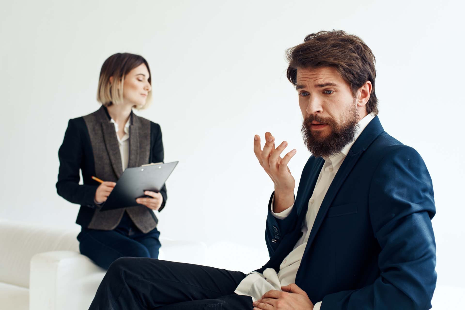 A therapist and client in a reflective session, symbolizing the introspective process of Psychoanalytic Therapy.