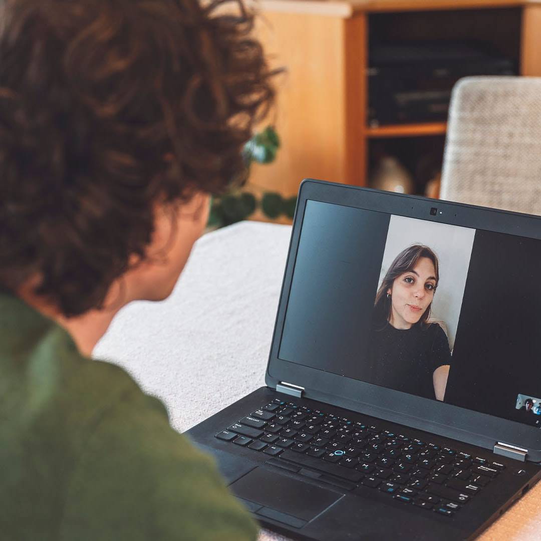 Man having an exclusive online therapy session via video call with a therapist