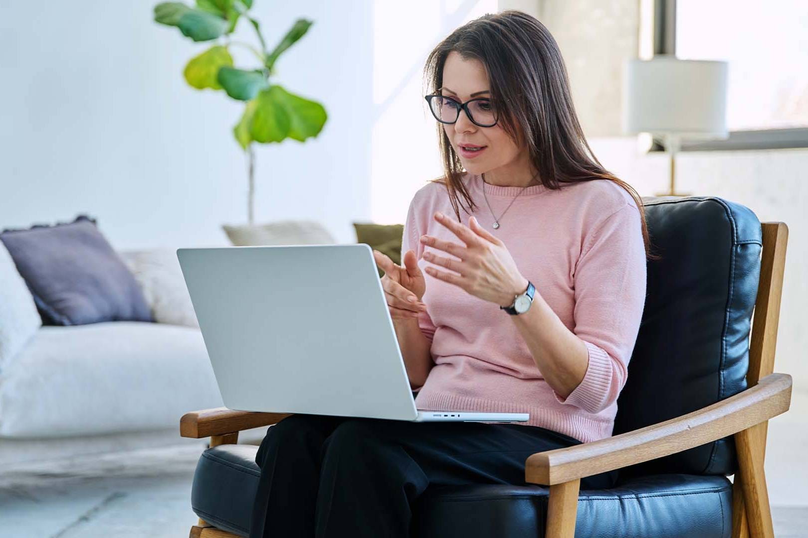Executive leader experiencing decision fatigue during online therapy session showing mental exhaustion from constant high-stakes choices