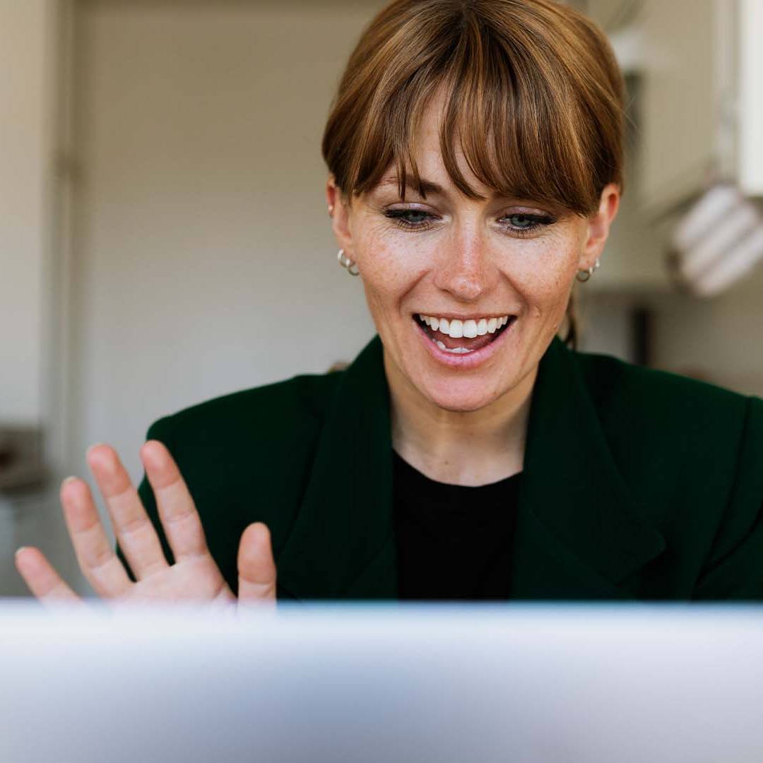 California startup founder engaging in positive online therapy session from home kitchen representing accessible mental health support for entrepreneurs