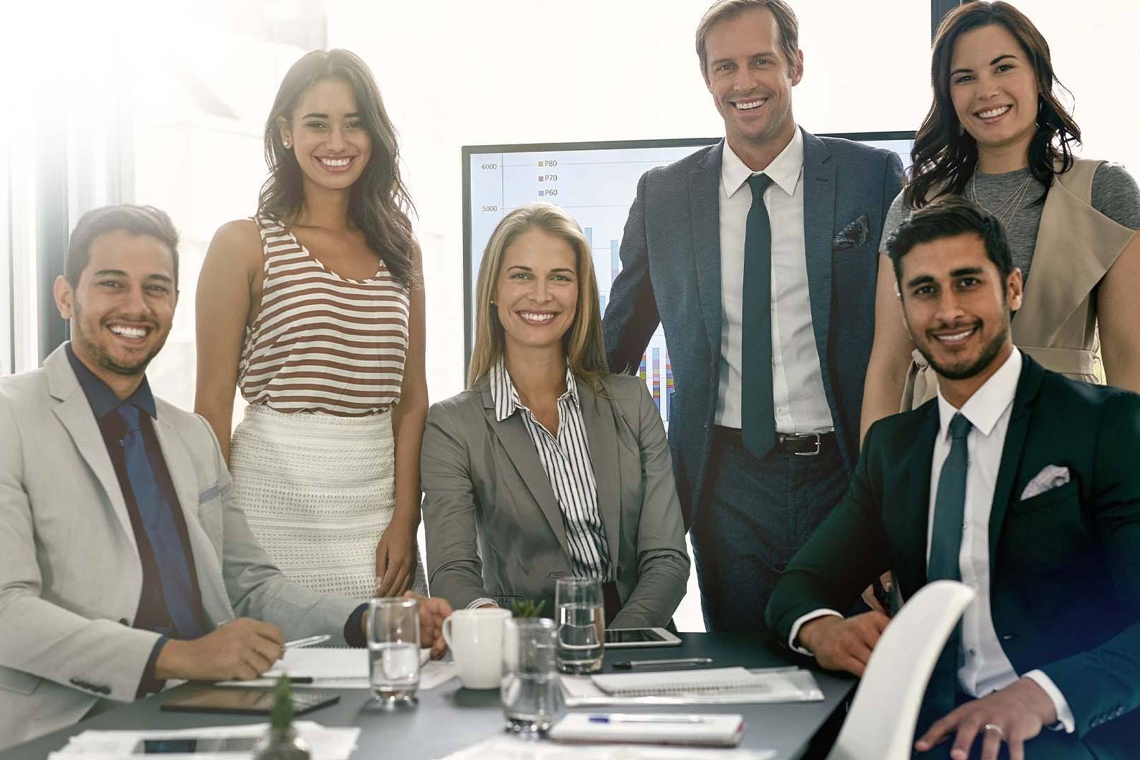 Diverse executive leadership team maintaining professional appearance while experiencing hidden psychological costs of leadership requiring mental health support