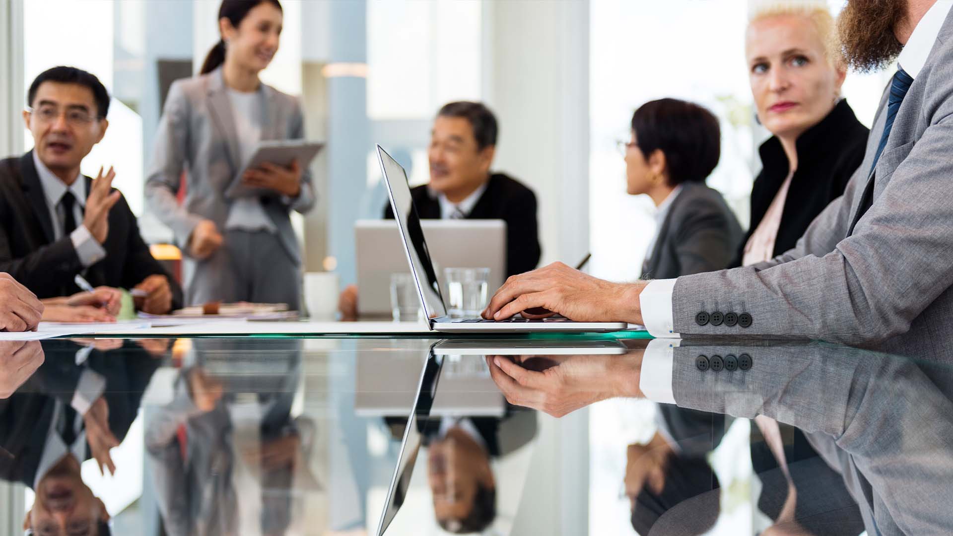 Diverse CEO leadership team in boardroom representing 71% of chief executives experiencing burnout requiring evidence-based solutions and support