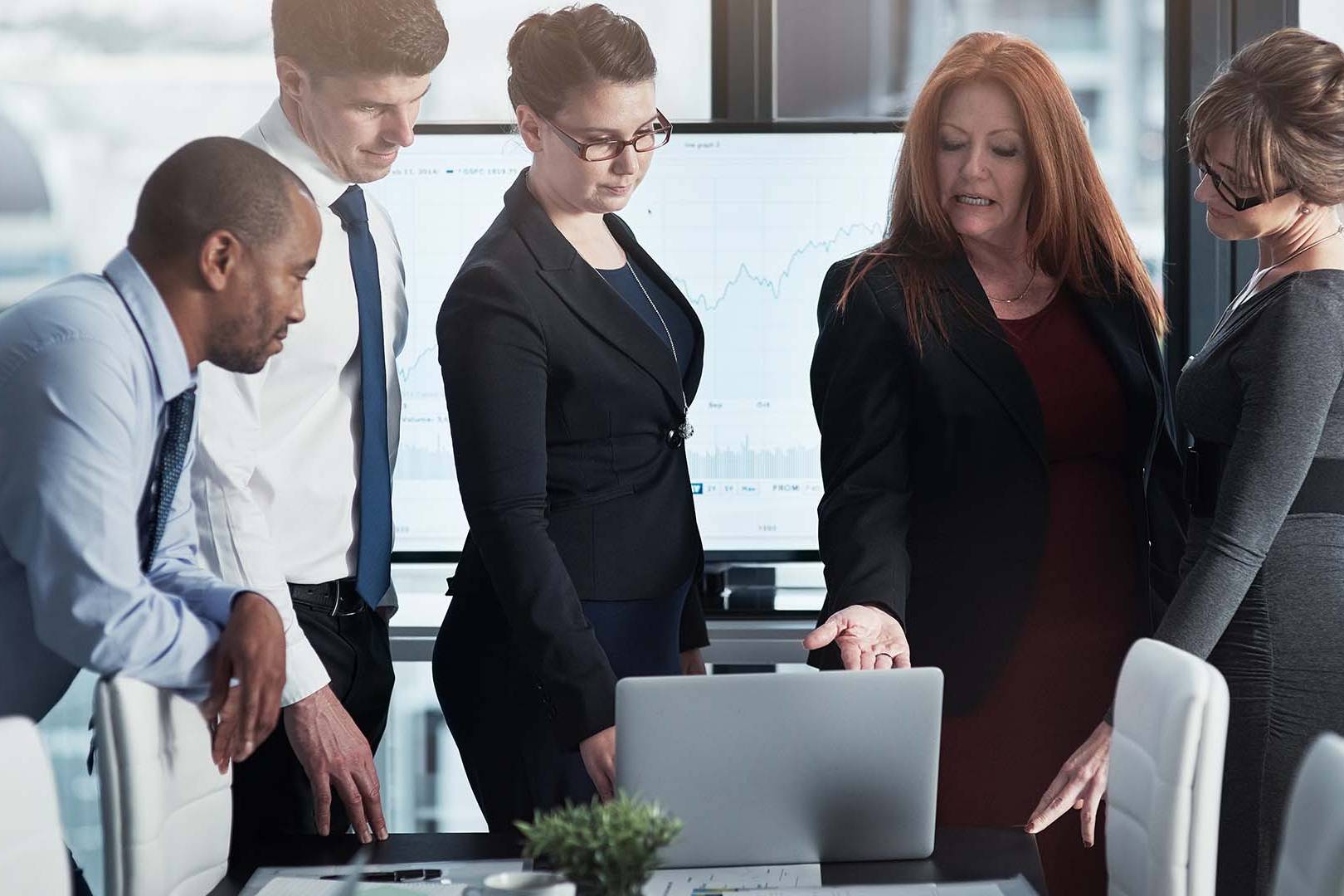 Diverse executive team in conference room representing leaders experiencing early warning signs of burnout requiring intervention before crisis