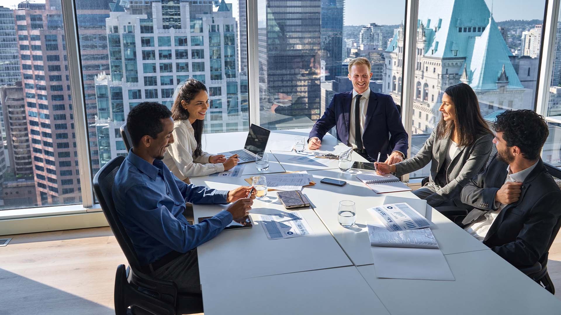 C-suite executive team in boardroom meeting maintaining professional composure while experiencing hidden burnout and exhaustion epidemic