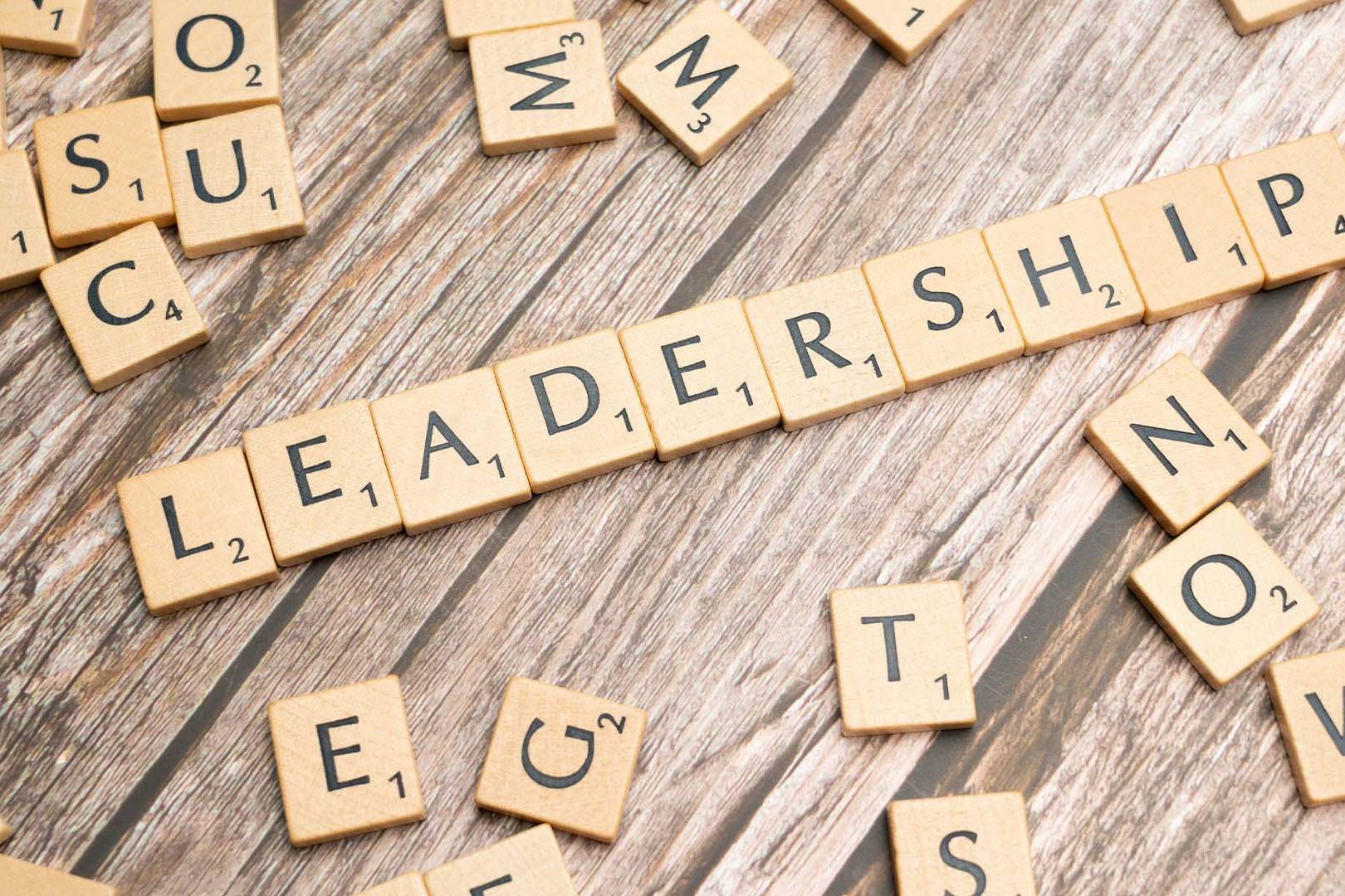 Wooden Scrabble letter tiles spelling out the word