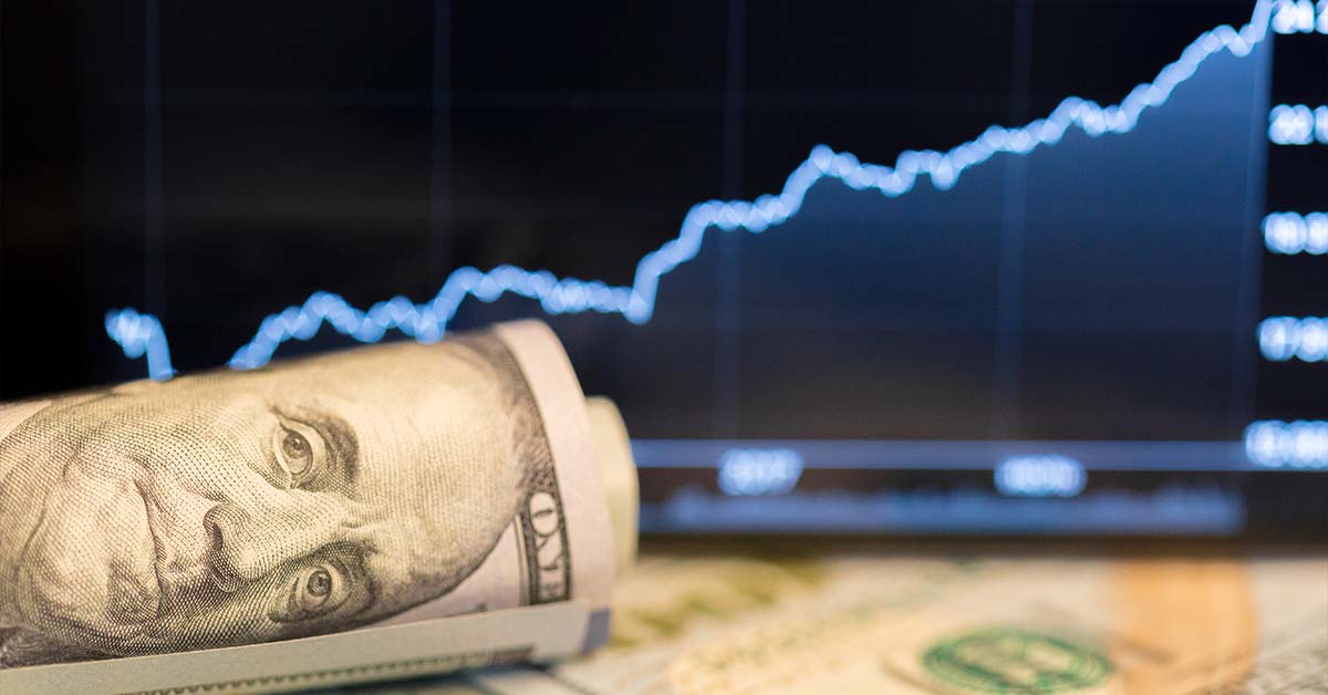 A rolled hundred dollar bill in front of a rising digital stock chart, featured image for the article Therapy for Chicago Hedge Fund and Prop Traders.