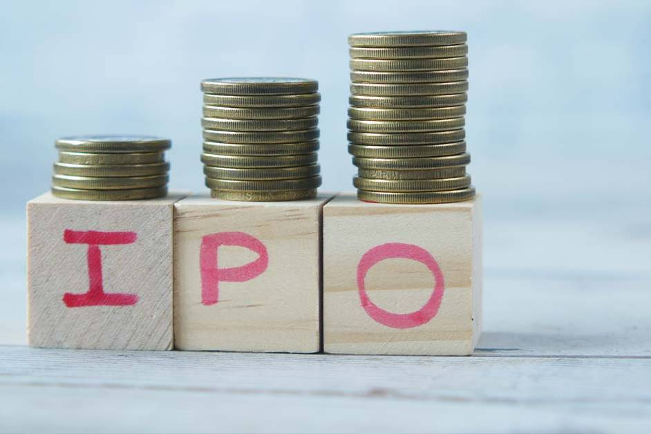 Three wooden blocks spelling IPO with rising stacks of gold coins, featured image for the article Therapy for IPO CFOs.