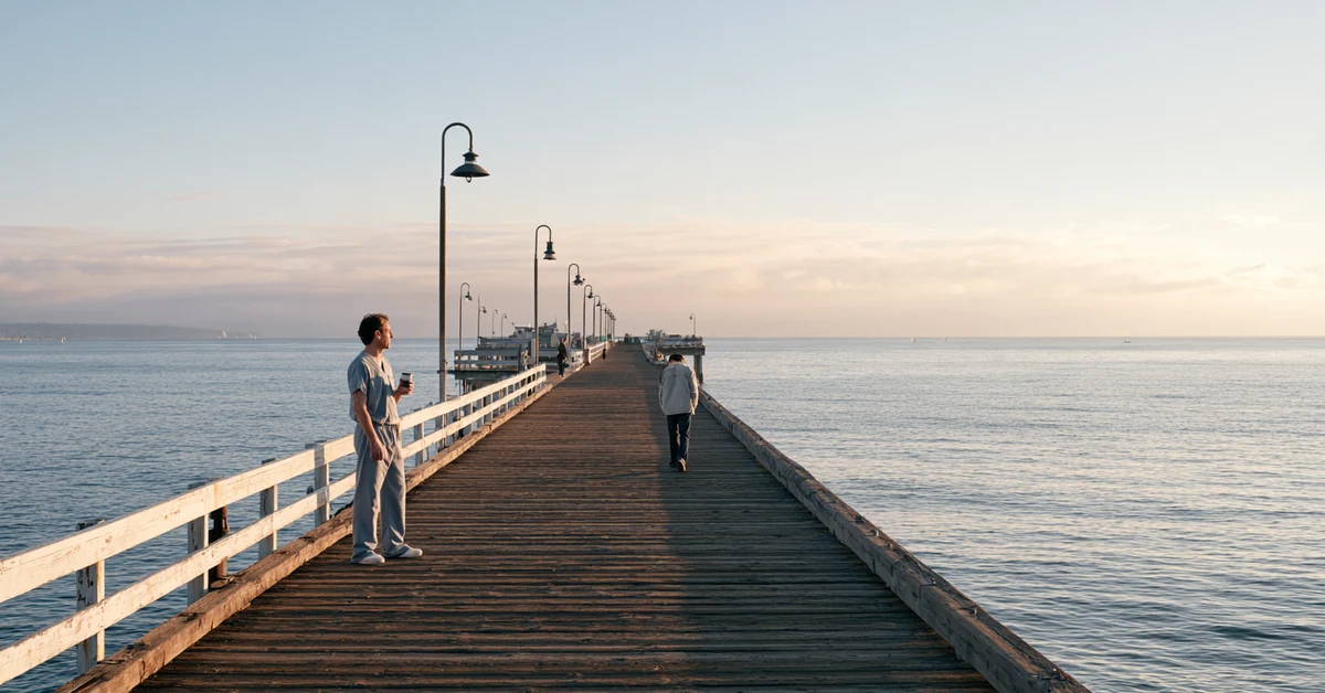 Couple a few feet apart at the end of a San Diego pier at dawn, illustrating couples therapy San Diego with CEREVITY